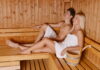 Young couple enjoying sauna